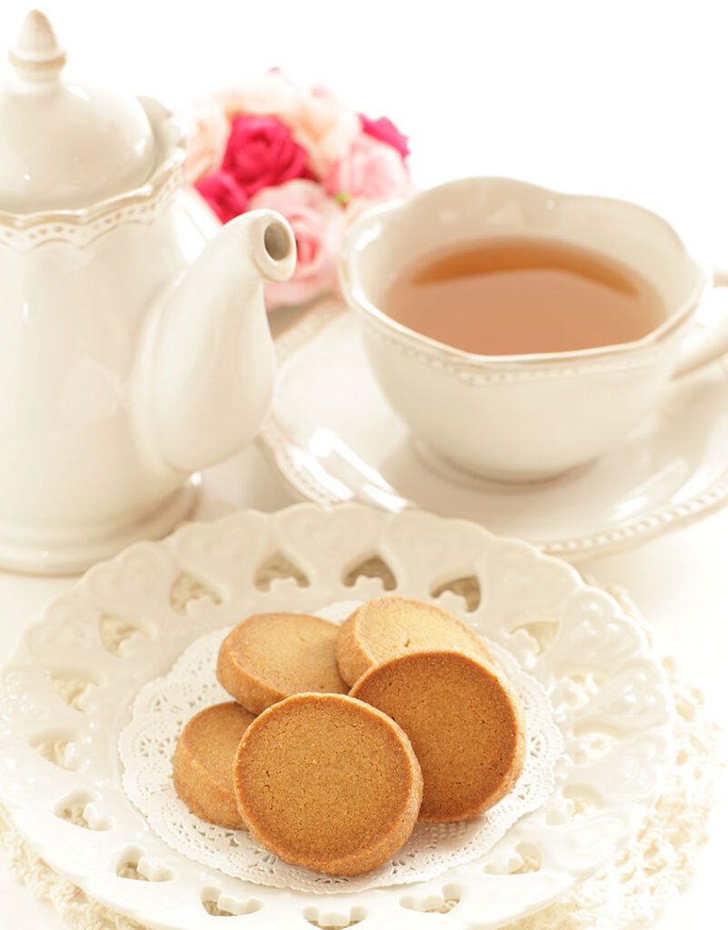 Cup of Tea with Biscuit on fancy plate